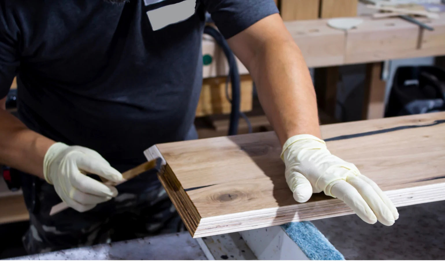 craftsmanship at Möbelsohn: carpenter works on a draw front, filing it by hand