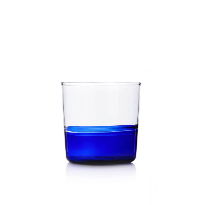 glass water tumbler series Light by Alba Gallizia with blue bottom and clear top, photographed on white background