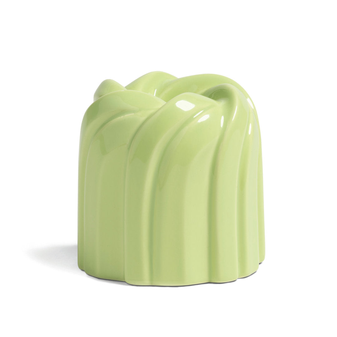 candle holder "cake" with a swirl pattern shape inspired by bundting cakes in a pistachio green shade on a white background