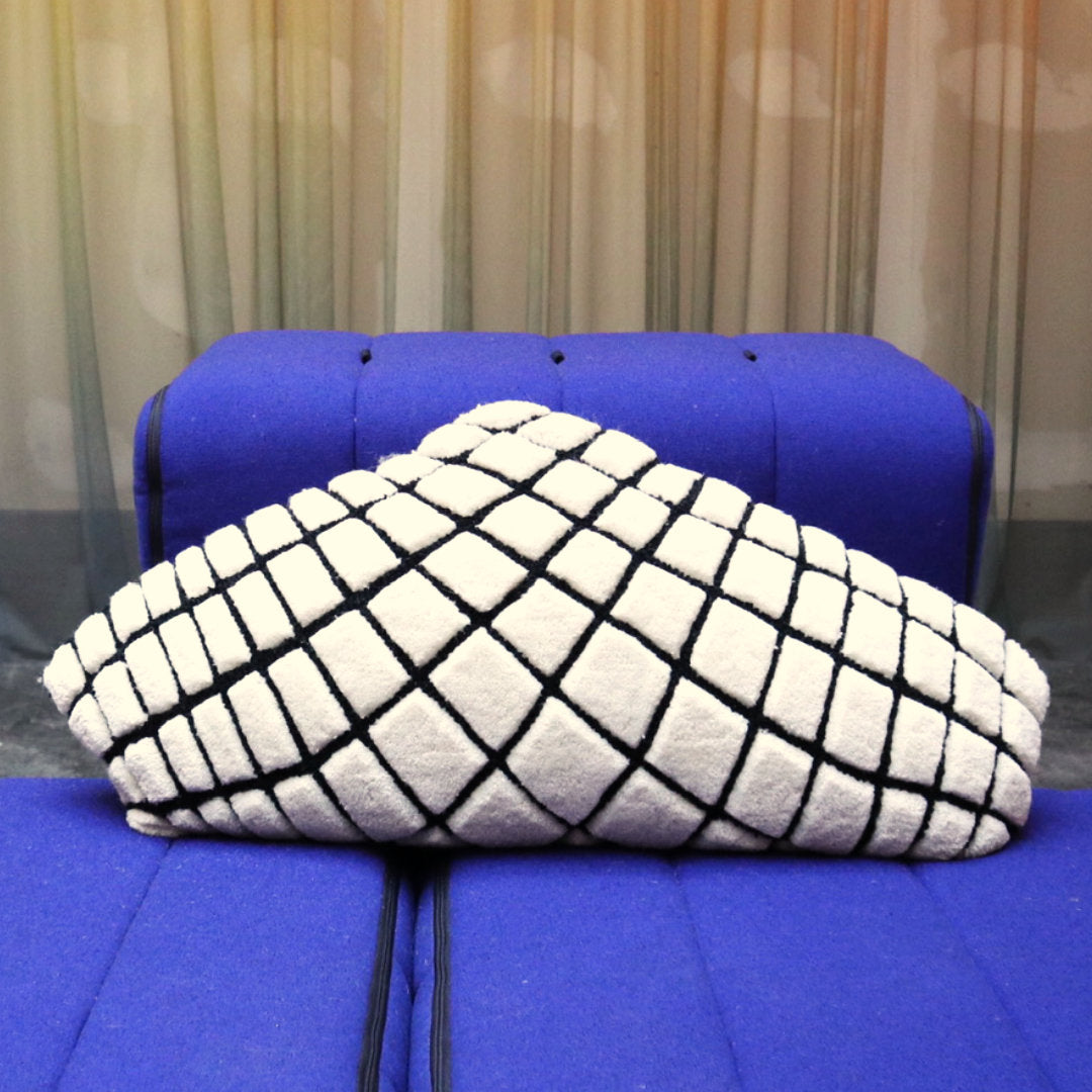 The Grip Wool Tufted Cushion by Trine Krüger | Triangular Shape | Black Grid Design on White Base | Haus Üger Exclusive