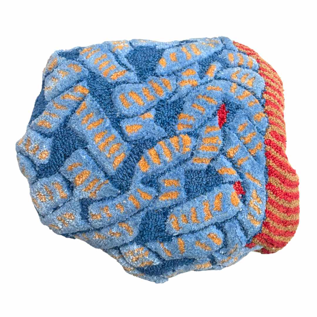 wool tufted cushion, red, blue and yellow coloured abstract motif of a snake, designed by Trine Krüger of Haus Üger